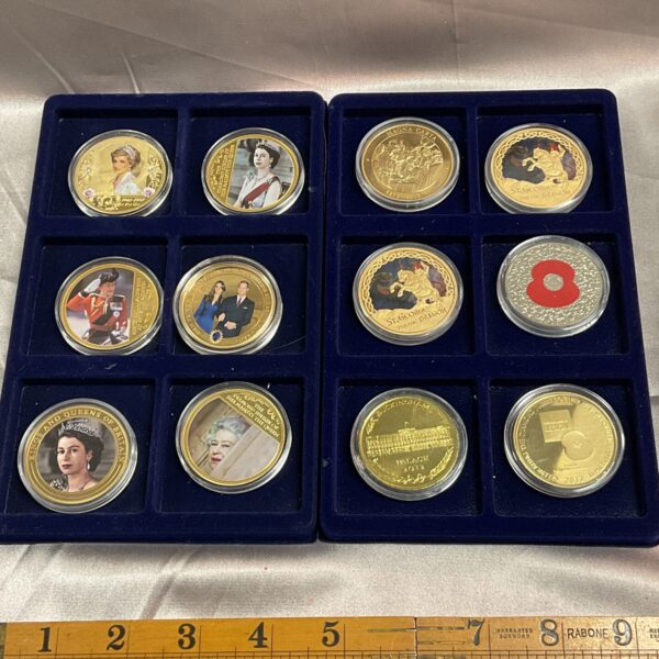 Lot of twelve royal family commemorative coins for collectors.