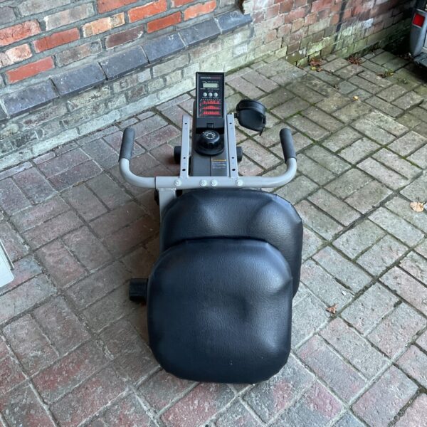 Front view of a used exercise bike with digital display.