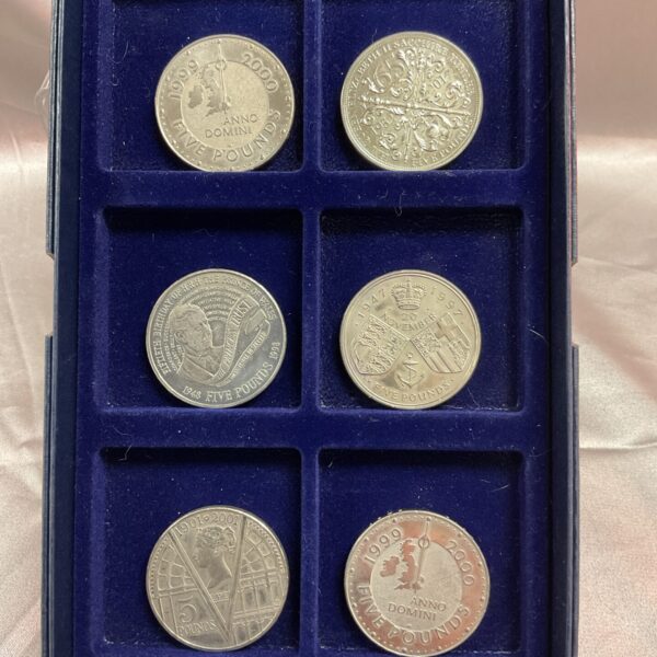 Lot of six commemorative £5 coins, including a Victoria coin.