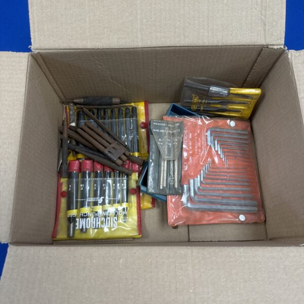 Assorted tool set with punch set and drill bits for DIY projects.