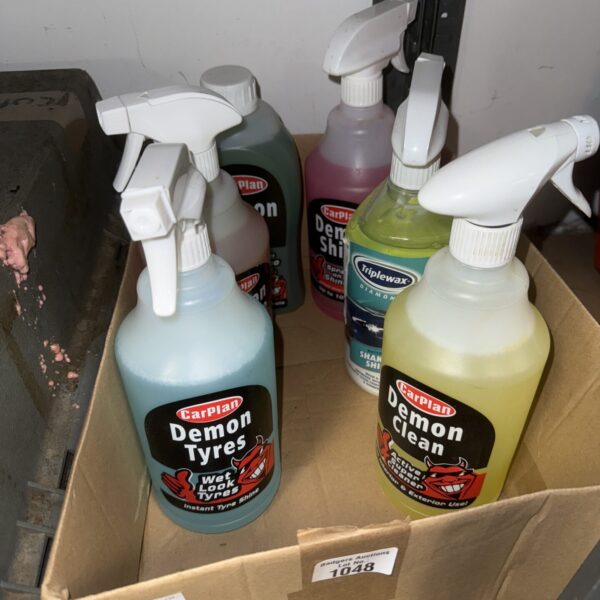 Selection of CarPlan Demon car cleaning sprays in a cardboard box.
