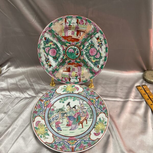 Antique Chinese Famille Rose plates with floral design.