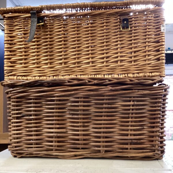 Vintage wicker baskets, a rustic pair for storage or display.