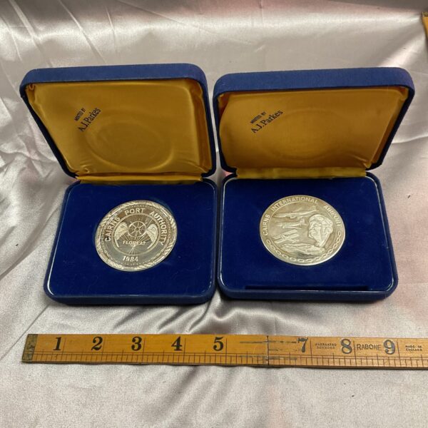 Cairns Airport Authority medals from 1984 in presentation cases.