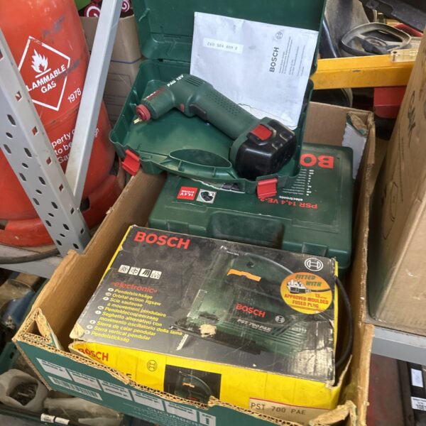 Vintage Bosch PST 700 E jigsaw power tool, side view.