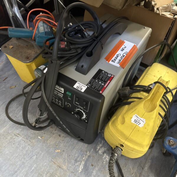 Unused Weldmate T136 MIG welder for metal fabrication.