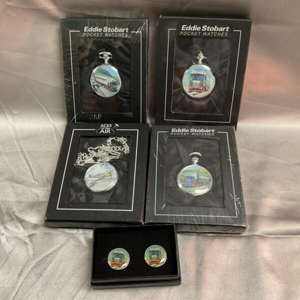 Eddie Stobart pocket watches and cufflinks, a collectible transport set.