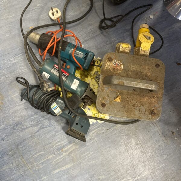 Vintage power tools lot with Black & Decker jigsaw and 110v transformer.