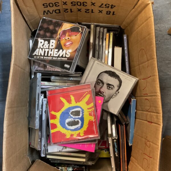 Box of mixed CDs including Primal Scream and R&B anthems.