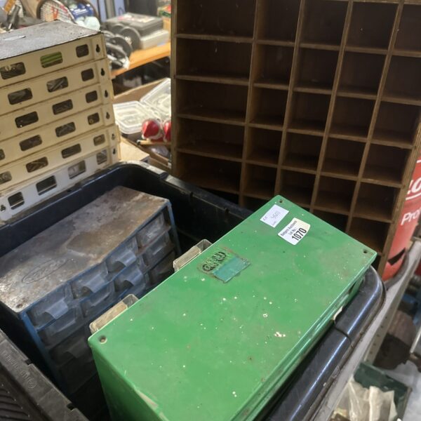 Vintage wooden pigeon hole unit with drawers for workshop storage.