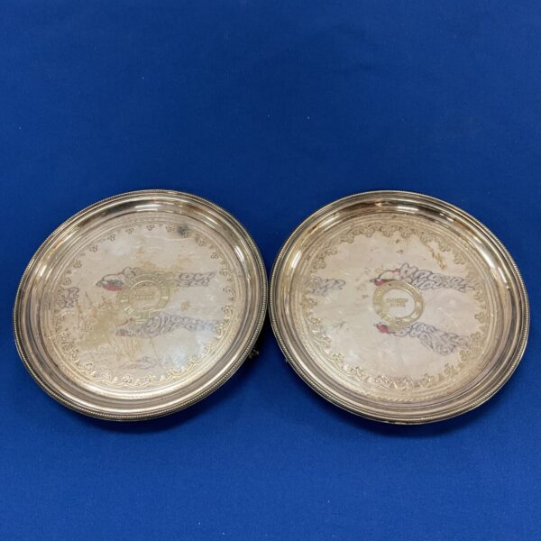 Antique silver plate trays with Swiss chalet railway scenes.