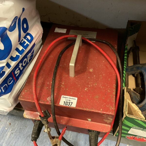 Front view of a used Dalcon power system with red and black cables.