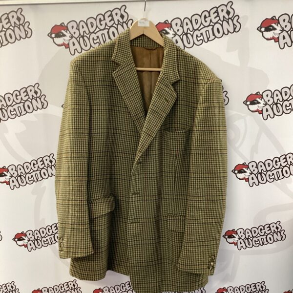 Front view of a vintage Buckingham Taylor tweed jacket.