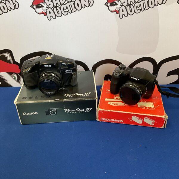 Vintage camera collection including Sony, Canon, and Nikai cameras.