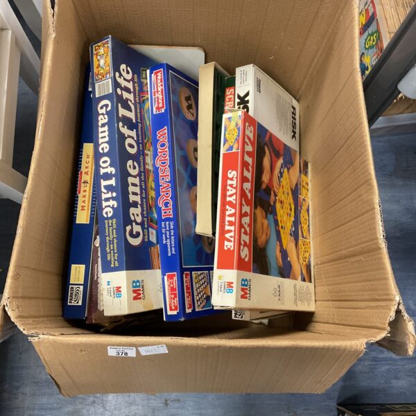 Vintage board games lot featuring Scrabble and Risk for collectors.