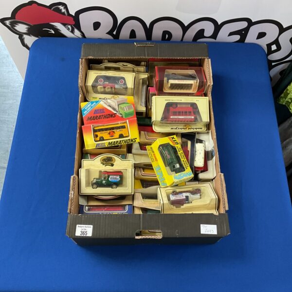 Tray of vintage diecast vehicle models, collectible toy cars.