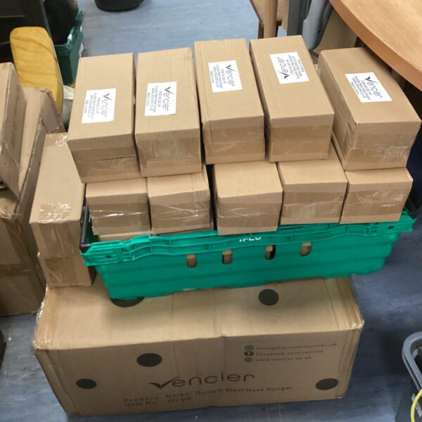 Large lot of Vencier steel hose hangers for industrial applications.