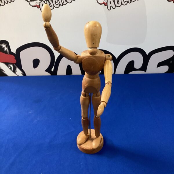 Wooden artist mannequin for figure drawing and posing.