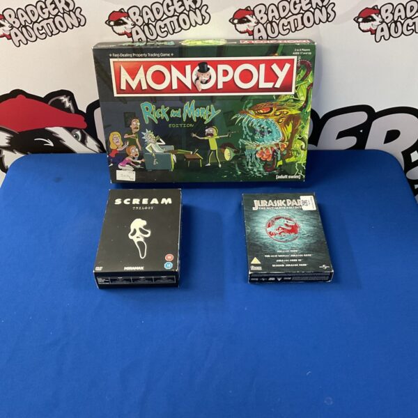 Rick and Morty Monopoly board game with Scream and Jurassic Park DVDs.
