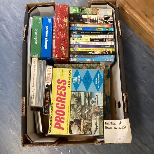 Mixed lot of DVDs and games for home entertainment.