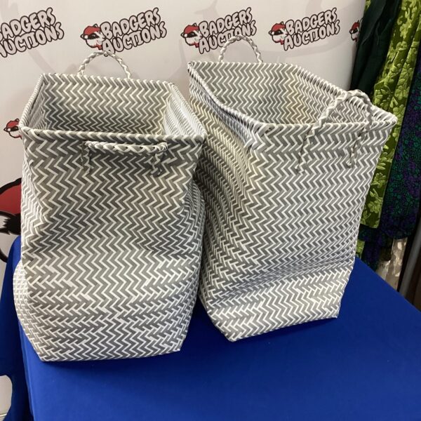 Two woven laundry baskets for home storage.