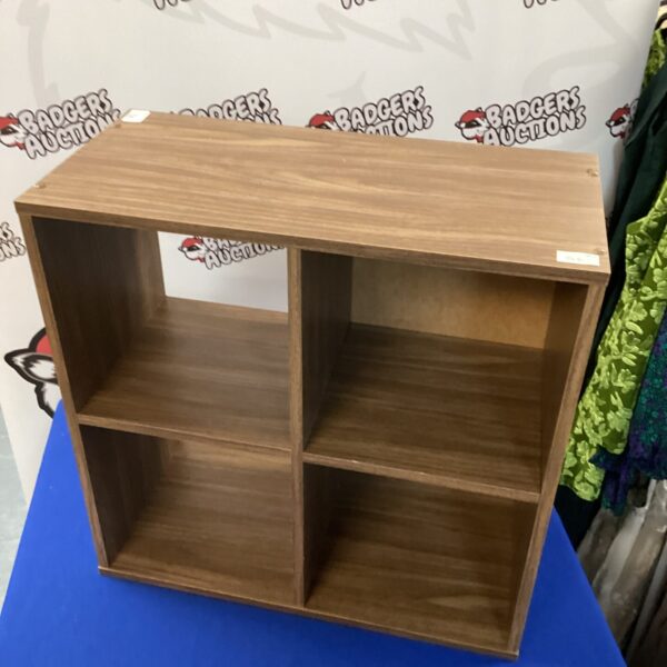 Wooden small display cabinet with four cubbyholes.