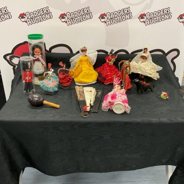 Vintage Spanish dolls and hand fans collection, showcasing Spanish culture.