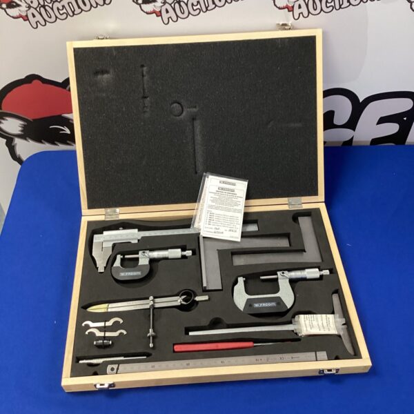 Vintage Facom calibration set with wooden case and precision tools.