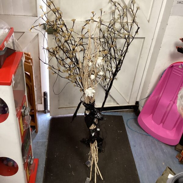 Two artificial light up plants for shop display or home decor.