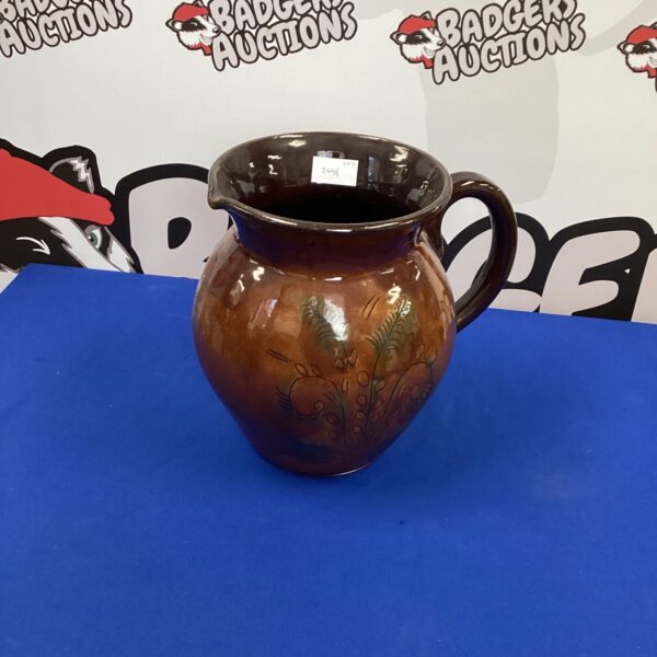 Large handmade glazed stoneware jug with a rustic finish.