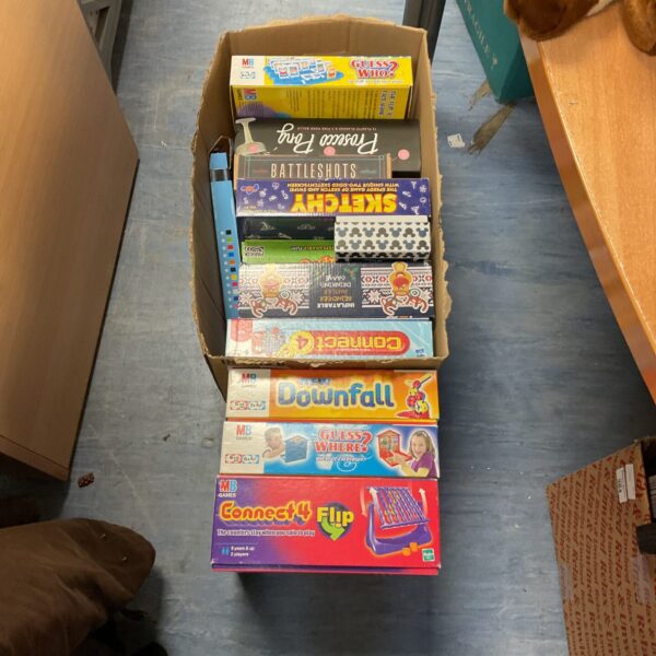 Mixed lot of vintage and family board games in a cardboard box.