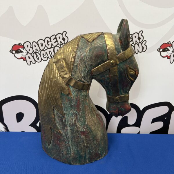 Vintage wooden and brass armored horse head sculpture.