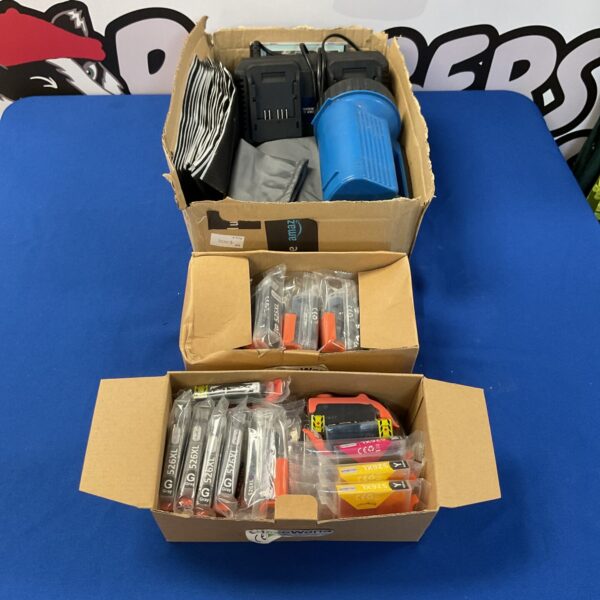 Mixed lot of office supplies including printer cartridges and a torch.