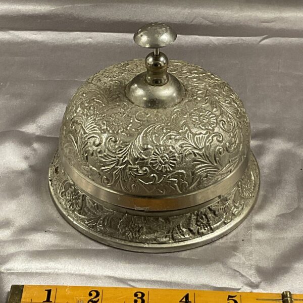 Intricate Art Nouveau brass reception bell with floral detailing.