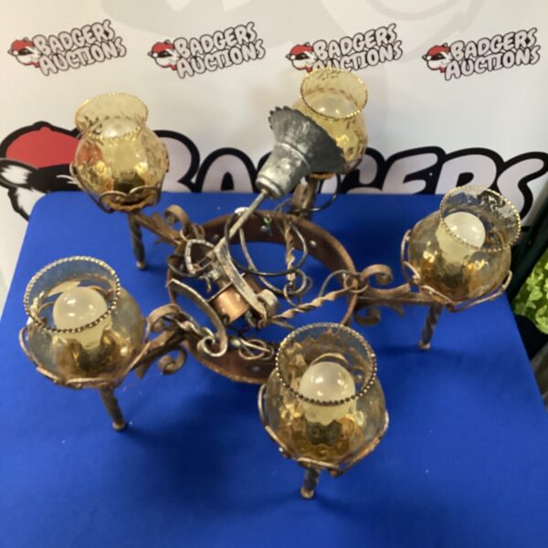 Antique medieval style wrought iron chandelier with cup holders.