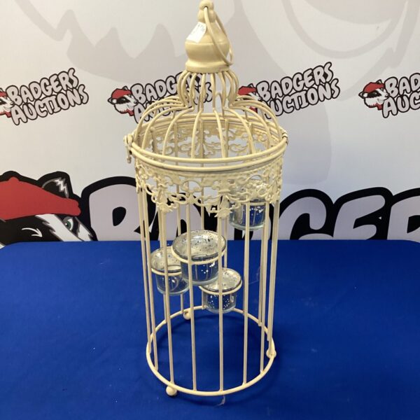 White metal four-tier tealight lantern for home decor.