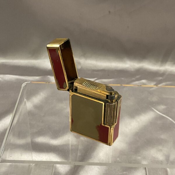 Vintage Dupont gas lighter with Art Deco design and red enamel.