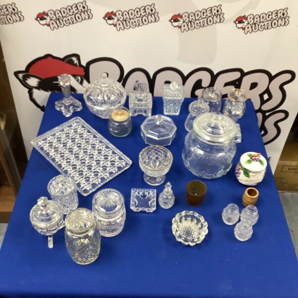 Vintage cut glass collection with cookie jar and decorative bowls.