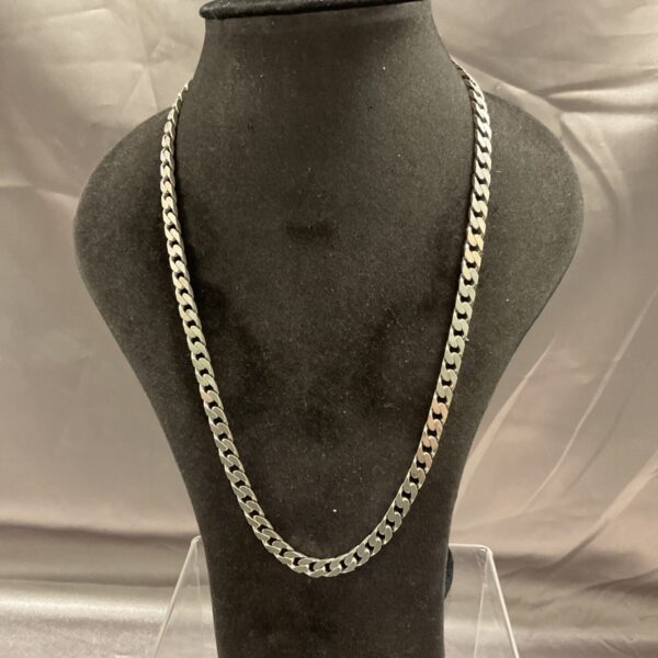 Close-up of a 20-inch silver curb chain necklace.