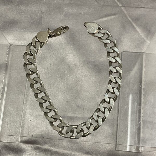 Close-up of a 925 silver curb chain bracelet with classic links.