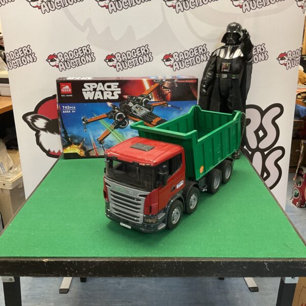 Mixed toy lot featuring Scania truck and Darth Vader figure.
