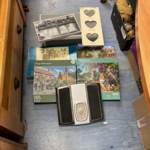 Overview of mixed lot collectibles including scale and puzzle.