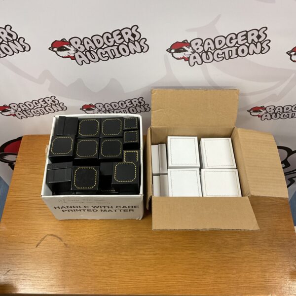 Lot of black and white empty storage boxes for moving or packing.