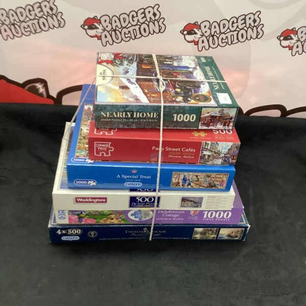 Selection of jigsaw puzzles, including 1000 and 500 piece puzzles.