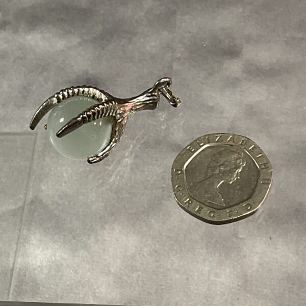 Silver tone claw pendant with green stone, gothic style jewellery.