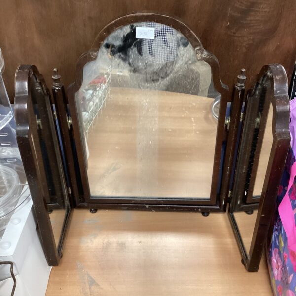 Vintage dressing table with a tri-fold mirror in a shabby chic style.