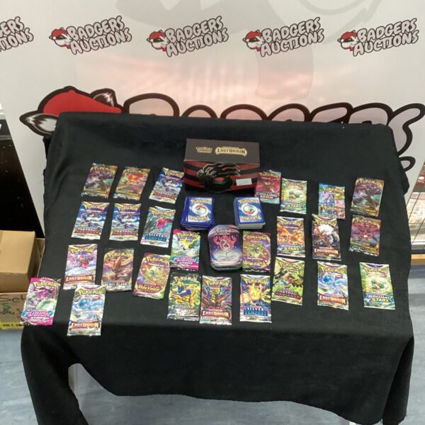 Pokemon card lot inside a metal case, collectible trading cards.
