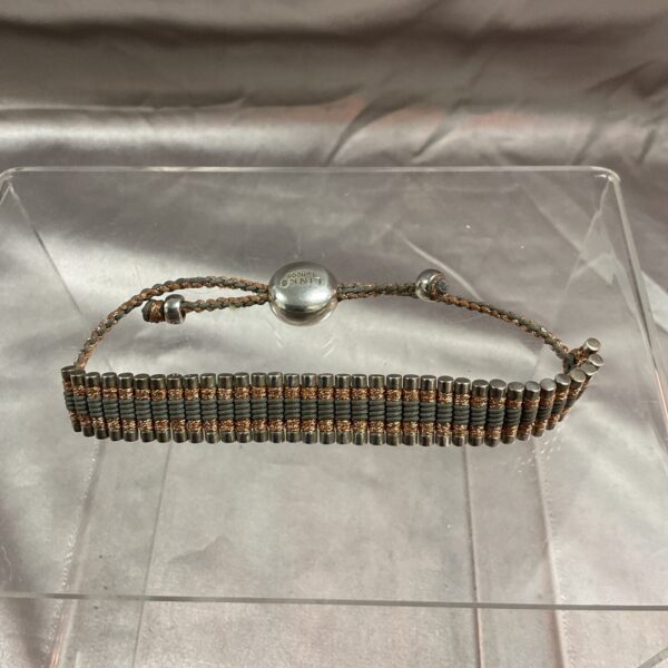 Silver and copper Links of London bracelet, detailed beadwork.
