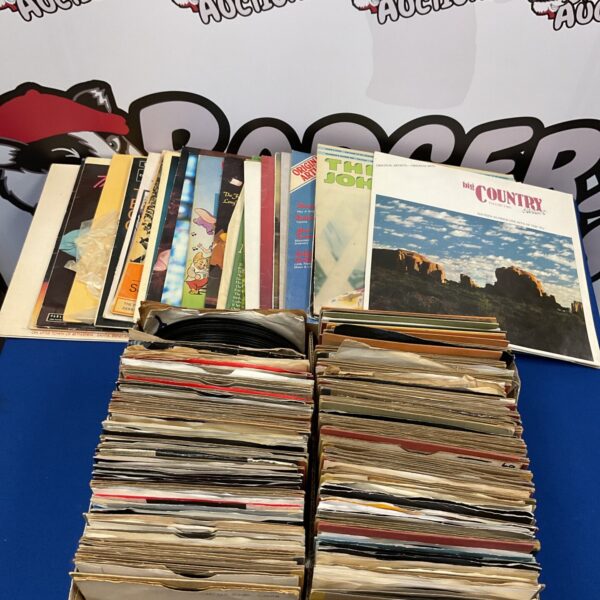 Large lot of vintage vinyl records including Cliff Richard and Benny Hill.