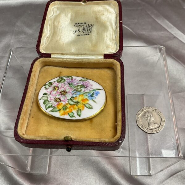 Vintage Limoges porcelain plaque with hand-painted floral design.